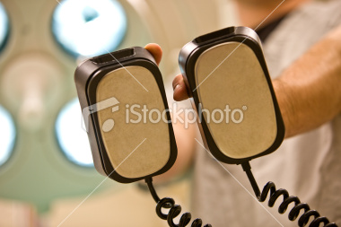 stock-photo-10681830-defibrillator-paddles-from-a-patient-s-perspective