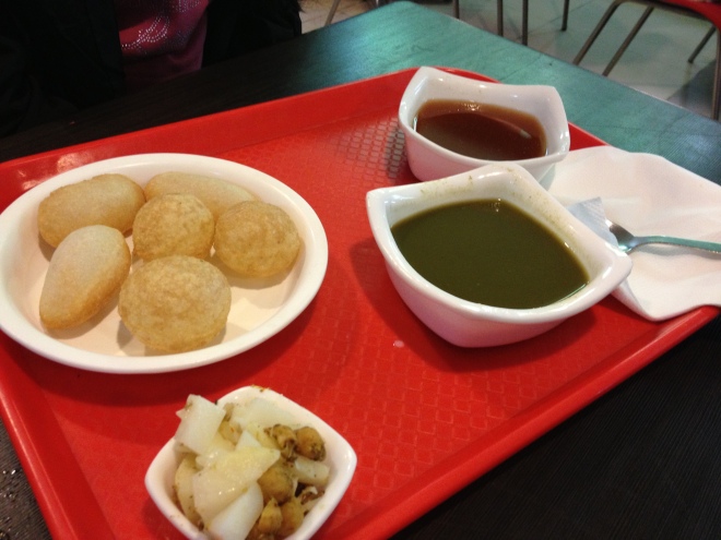 Pani Puri - Also known as fried thin hollow crisps which you break in the centre with your thumb, fill with unflavoured boiled potato pieces and dip in sweet and savoury sauce together - does that not sound perfect....