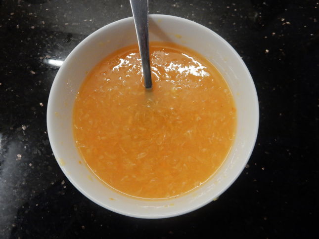 Tangerine juice with all the juice sacs with the granulated sugar stirred in